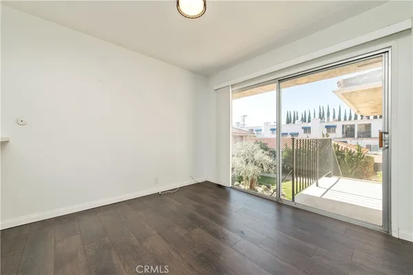 a view of a room with wooden floor and city view