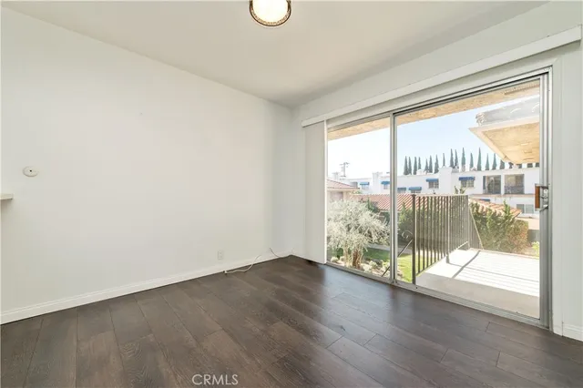 a view of a room with wooden floor and city view