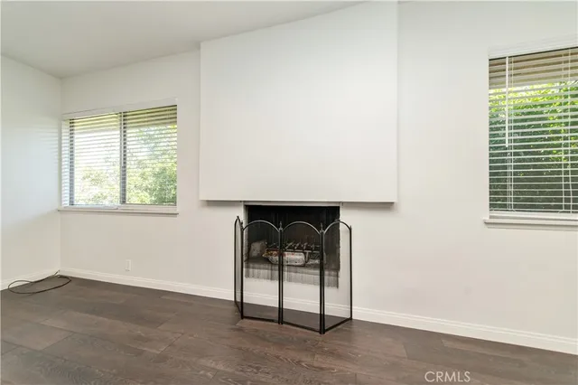 a room with a chair and a window