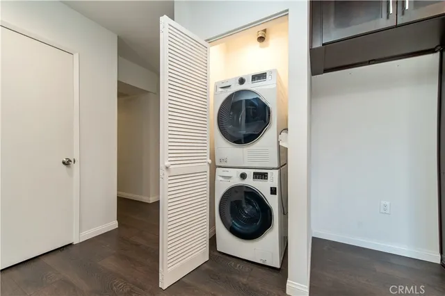 a view of a hallway with washer and dryer