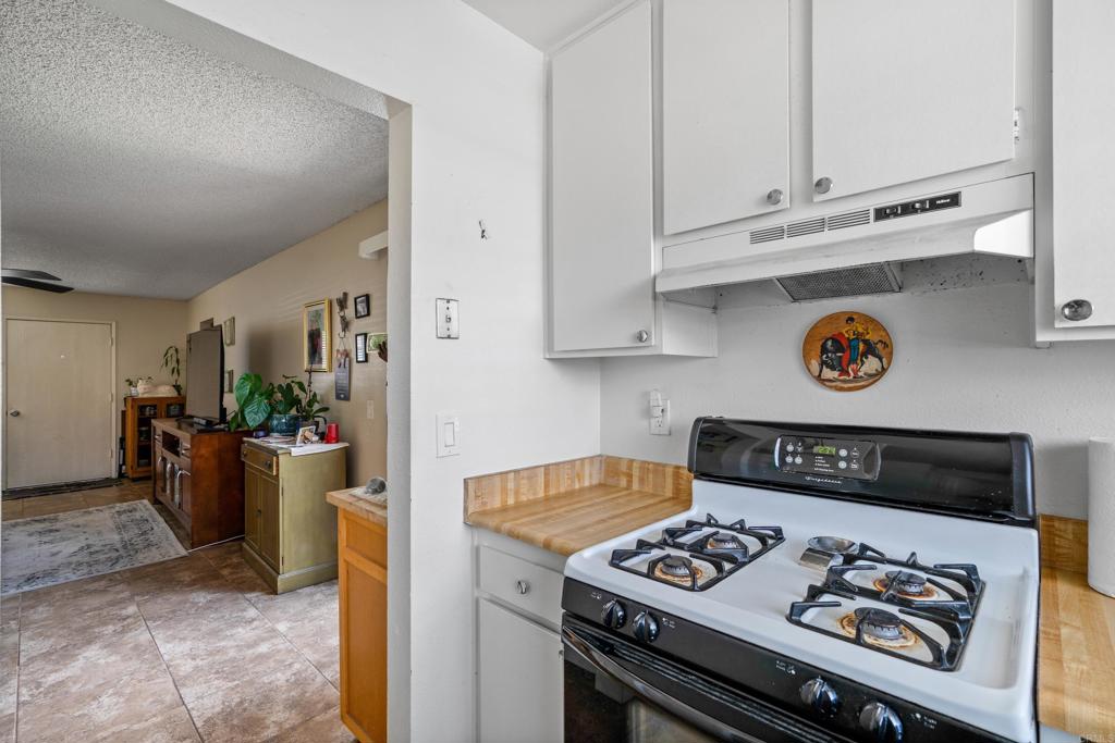 4533 Sunrise Oceanside, CA 92056 - Photo 16 of 24 a kitchen with a stove and a refrigerator