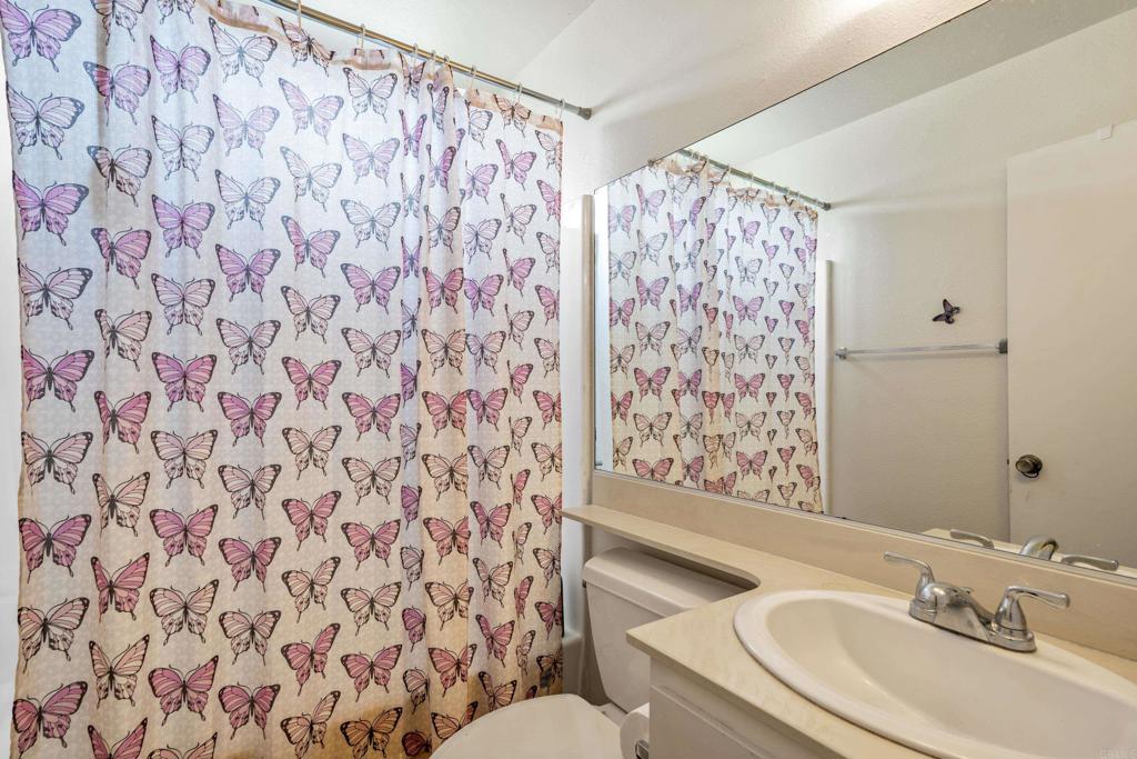 4533 Sunrise Oceanside, CA 92056 - Photo 2 of 24 a bathroom with a sink and a mirror