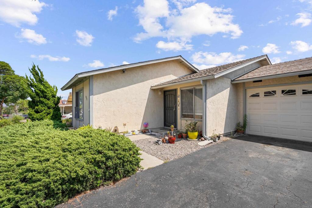 4533 Sunrise Oceanside, CA 92056 - Photo 24 of 24 a view of a house with potted plants in front of door
