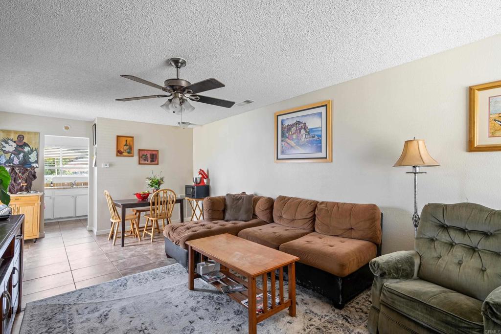 4533 Sunrise Oceanside, CA 92056 - Photo 3 of 24 a living room with furniture a couch and a chandelier