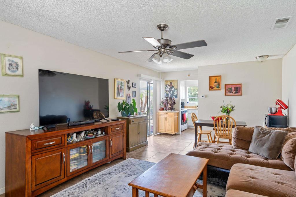 4533 Sunrise Oceanside, CA 92056 - Photo 5 of 24 a living room with furniture and a flat screen tv