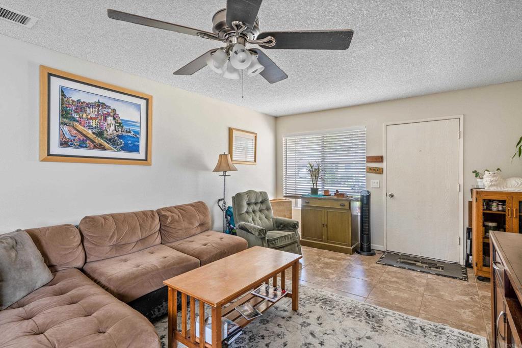 4533 Sunrise Oceanside, CA 92056 - Photo 6 of 24 a living room with furniture and a window
