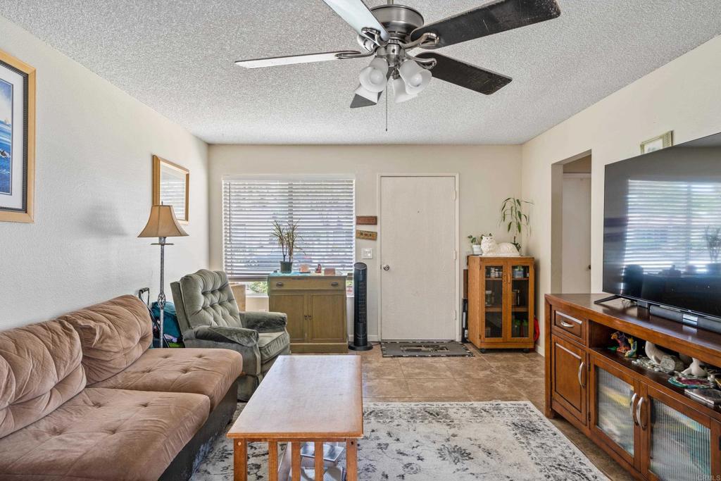 4533 Sunrise Oceanside, CA 92056 - Photo 7 of 24 a living room with furniture and a flat screen tv