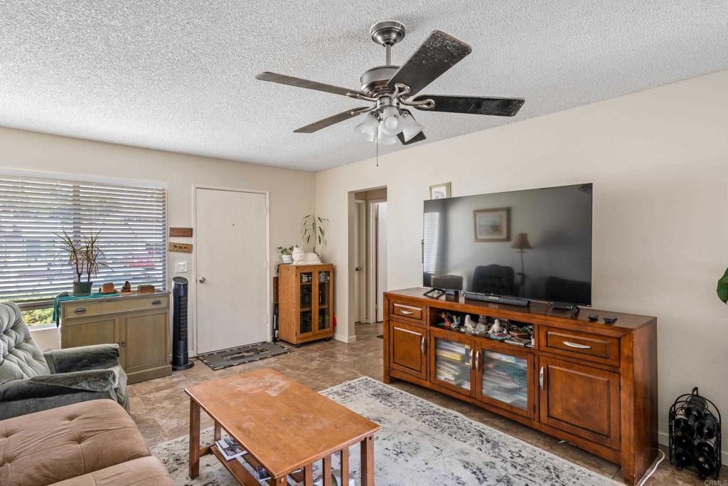 4533 Sunrise Oceanside, CA 92056 - Photo 8 of 24 a living room with furniture and a flat screen tv