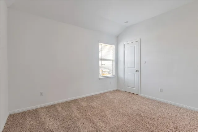 a view of a big room with closet and a ceiling fan