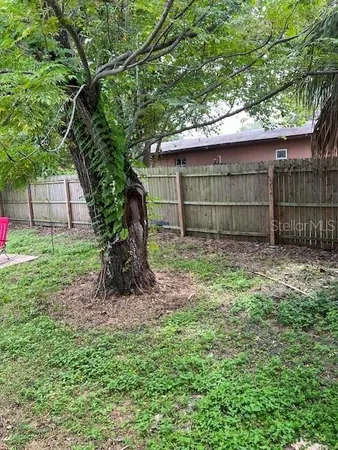 a view of a back yard of the house