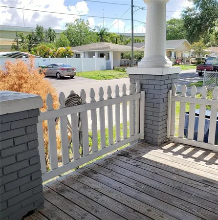 a front view of a house with outdoor seating