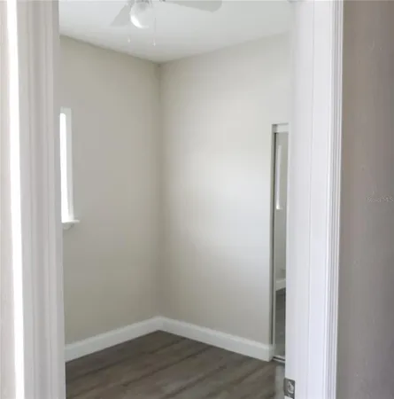 a view of small space with wooden floor