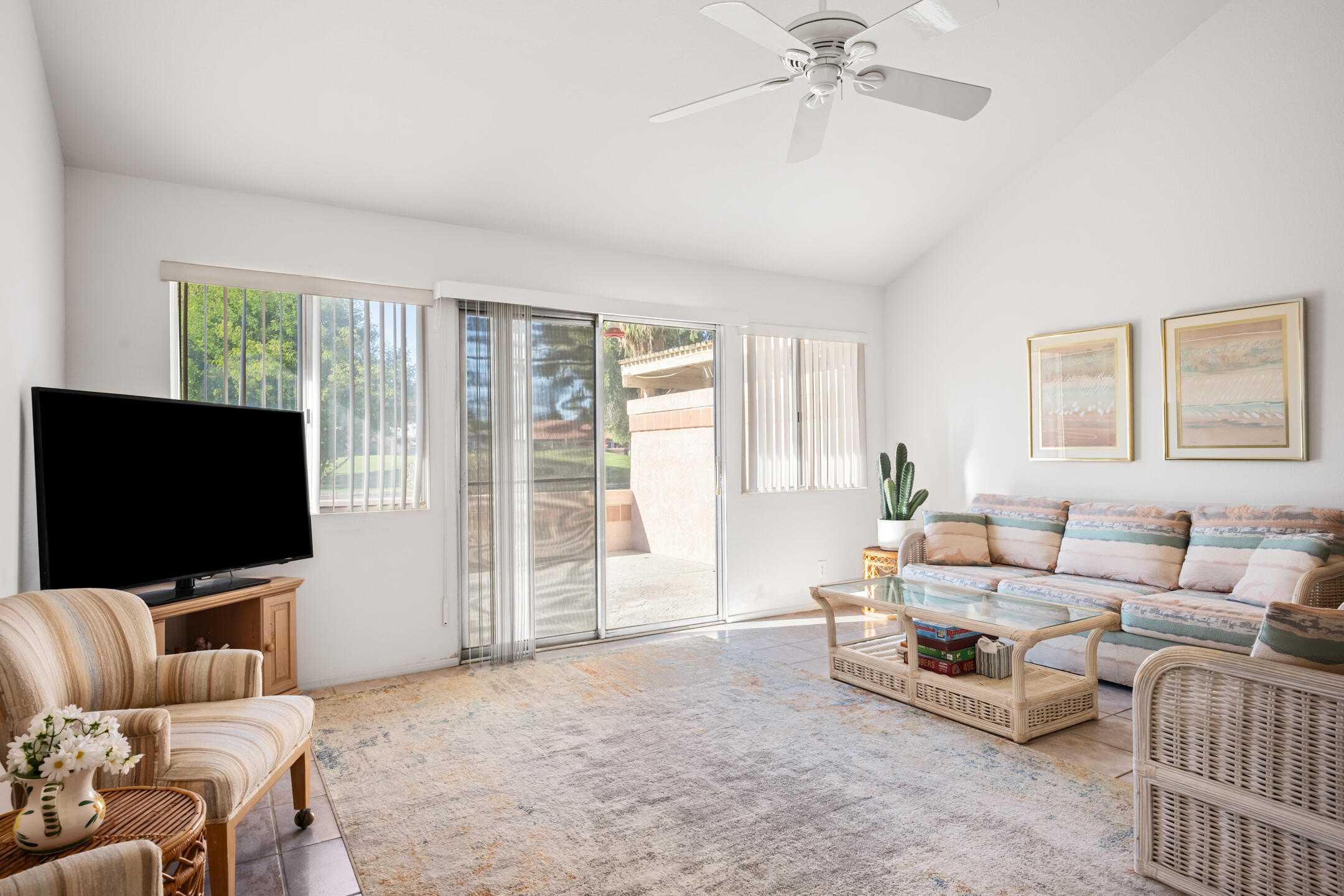 49211 Douglas Street Indio, CA 92201 - Photo 18 of 44 a living room with furniture and a flat screen tv