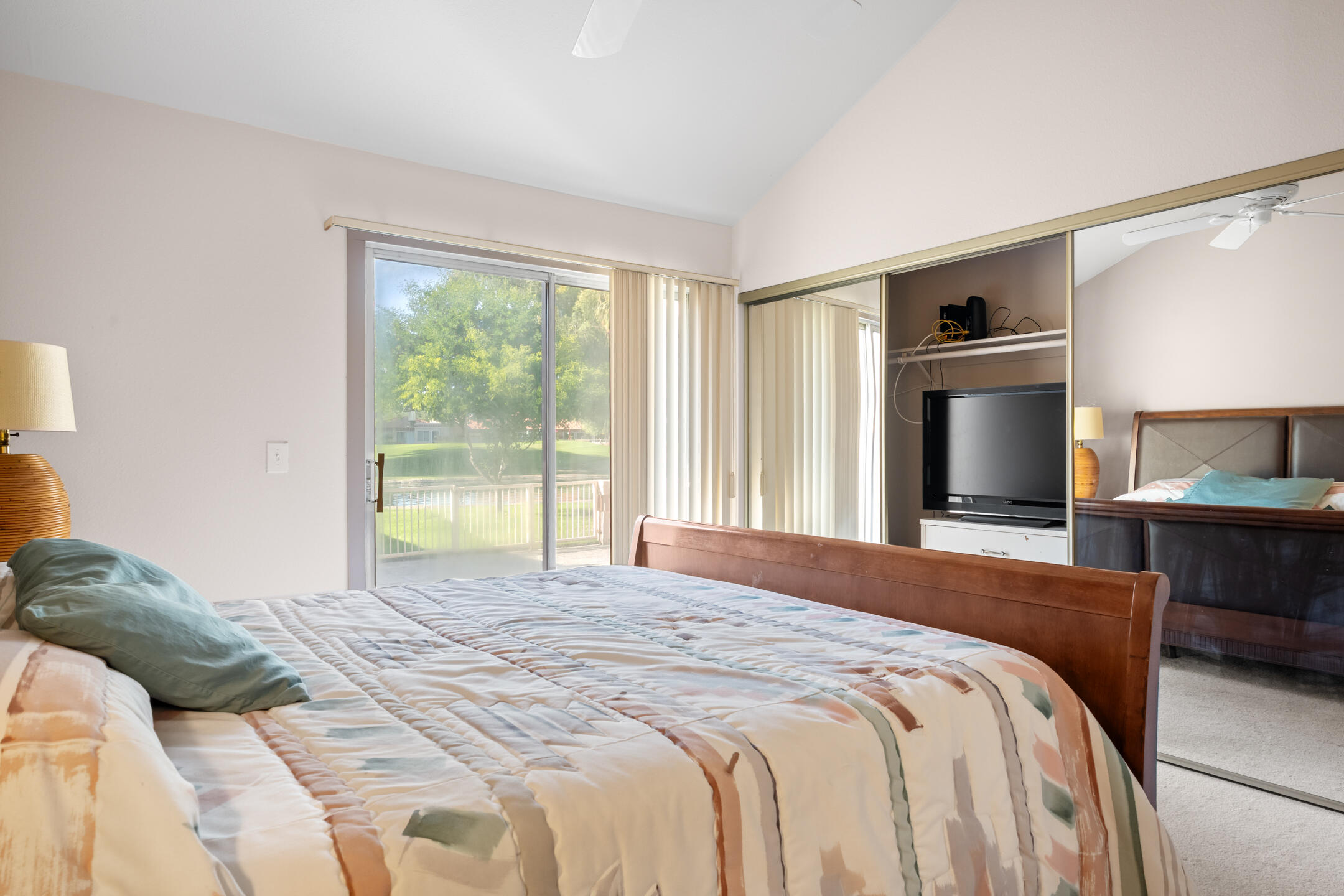 49211 Douglas Street Indio, CA 92201 - Photo 22 of 44 a bedroom with a large bed and a tv