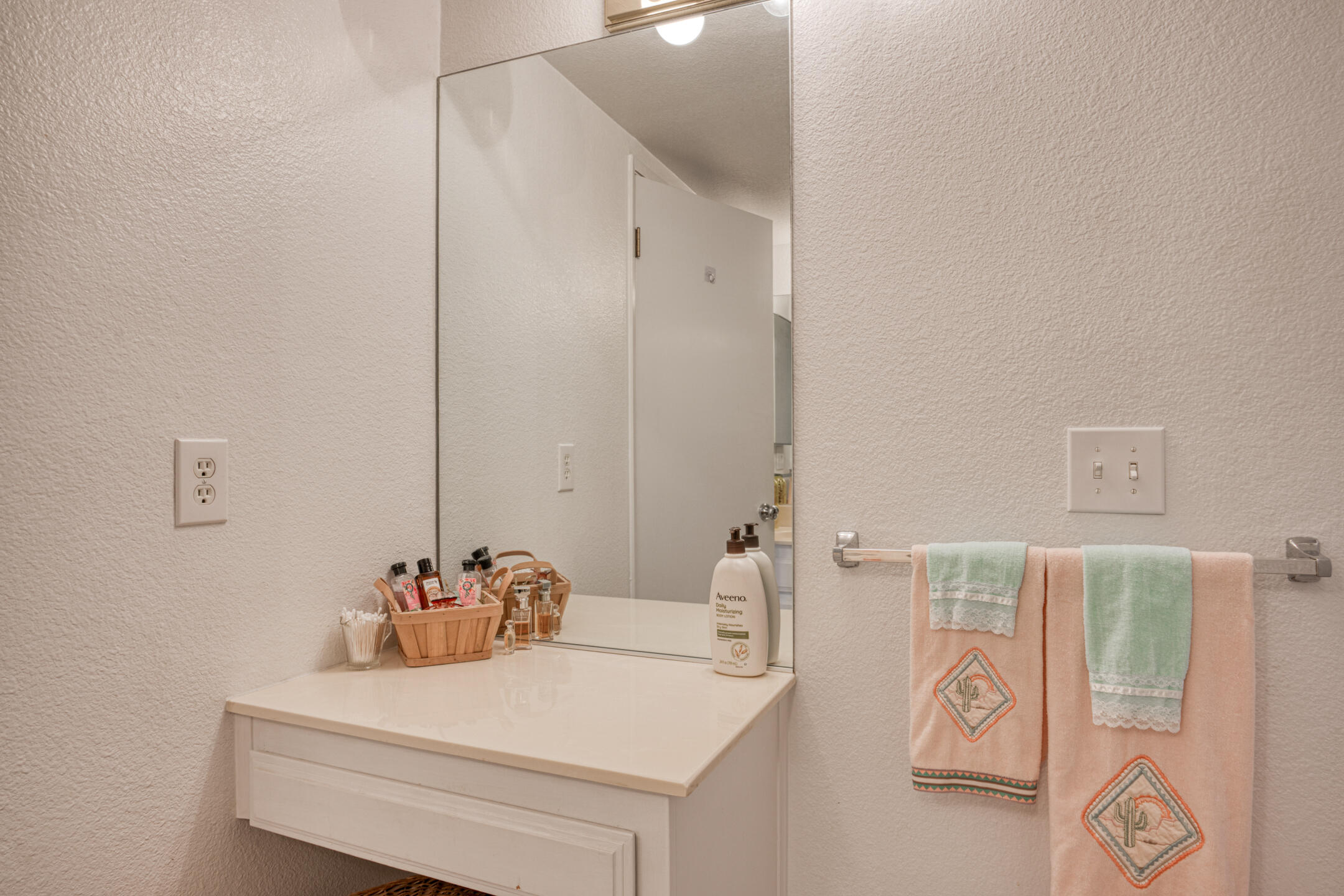 49211 Douglas Street Indio, CA 92201 - Photo 28 of 44 a bathroom with a sink and a mirror