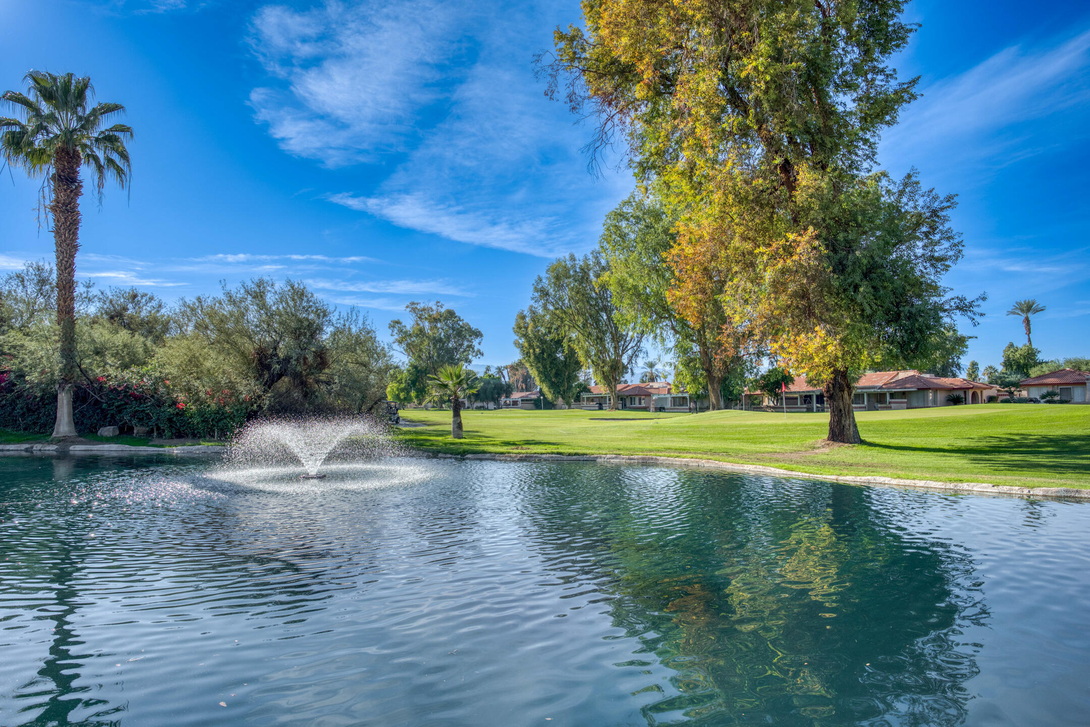 49211 Douglas Street Indio, CA 92201 - Photo 42 of 44 a view of a fountain in front of a house with a big yard