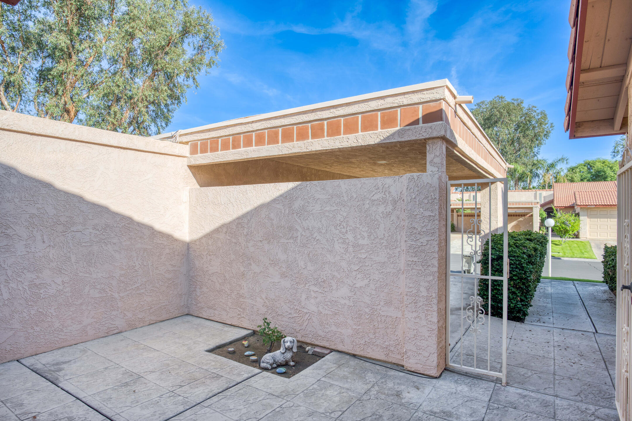 49211 Douglas Street Indio, CA 92201 - Photo 8 of 44 a view of backyard with potted plants