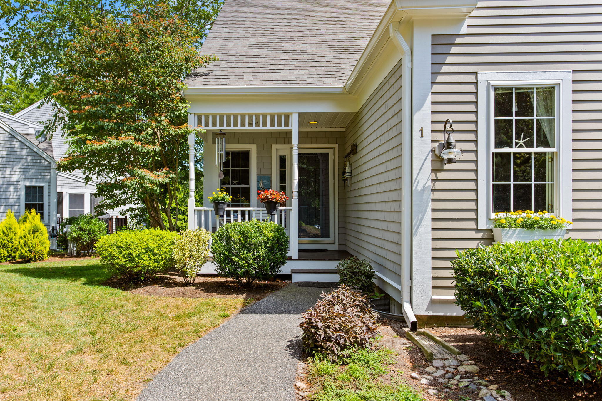 a front view of a house with garden