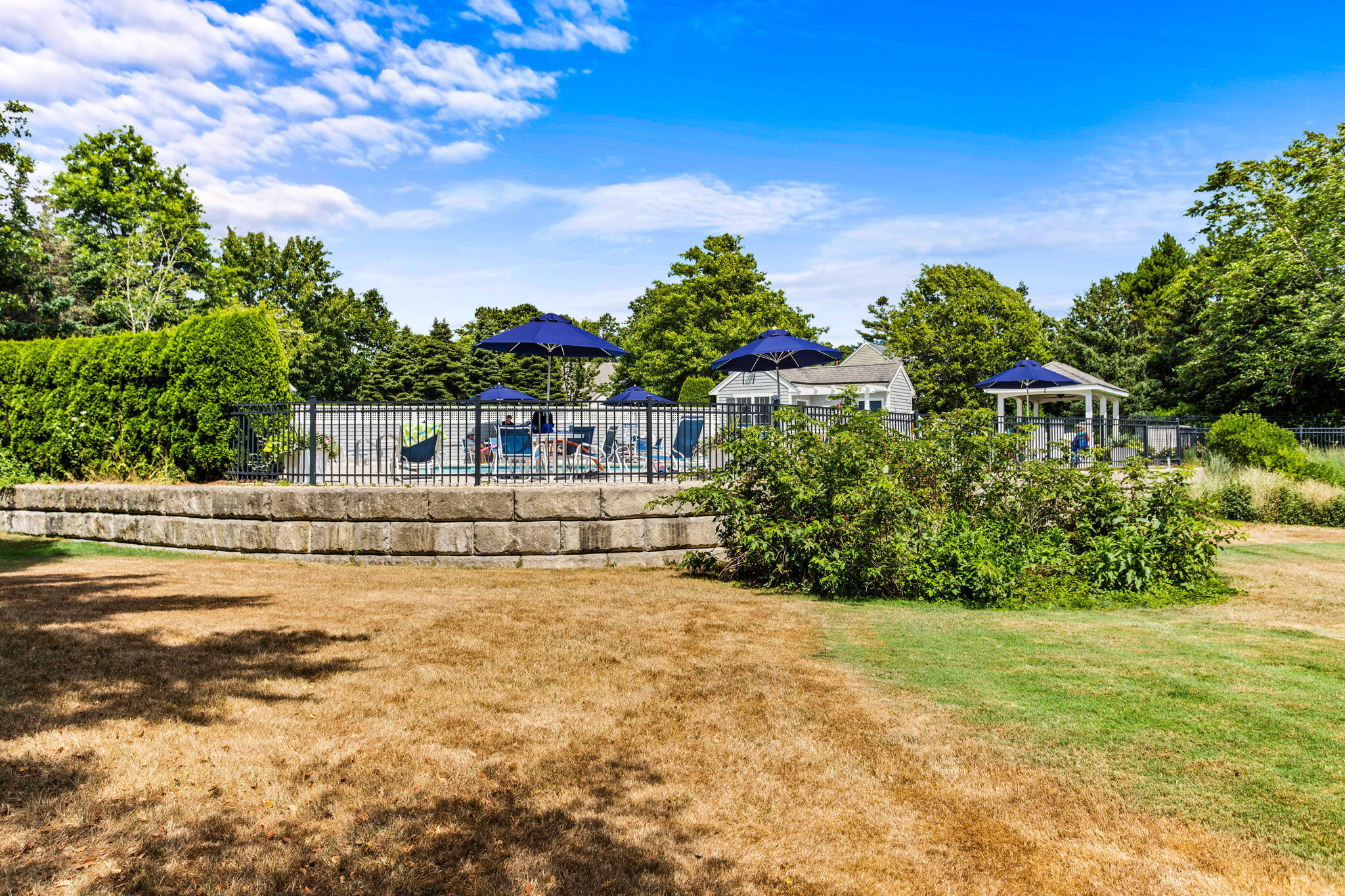 1 Prestwick Road Bourne, MA 02532 - Photo 27 of 32 a view of house with outdoor space and swimming pool