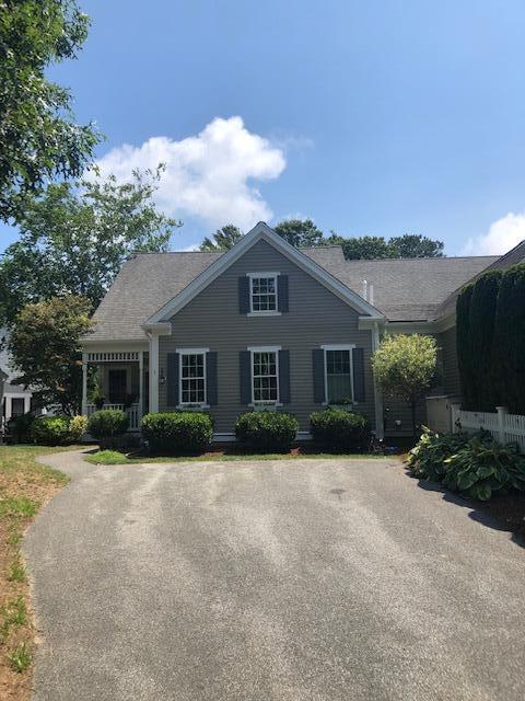 1 Prestwick Road Bourne, MA 02532 - Photo 3 of 32 a front view of a house with a yard and garage