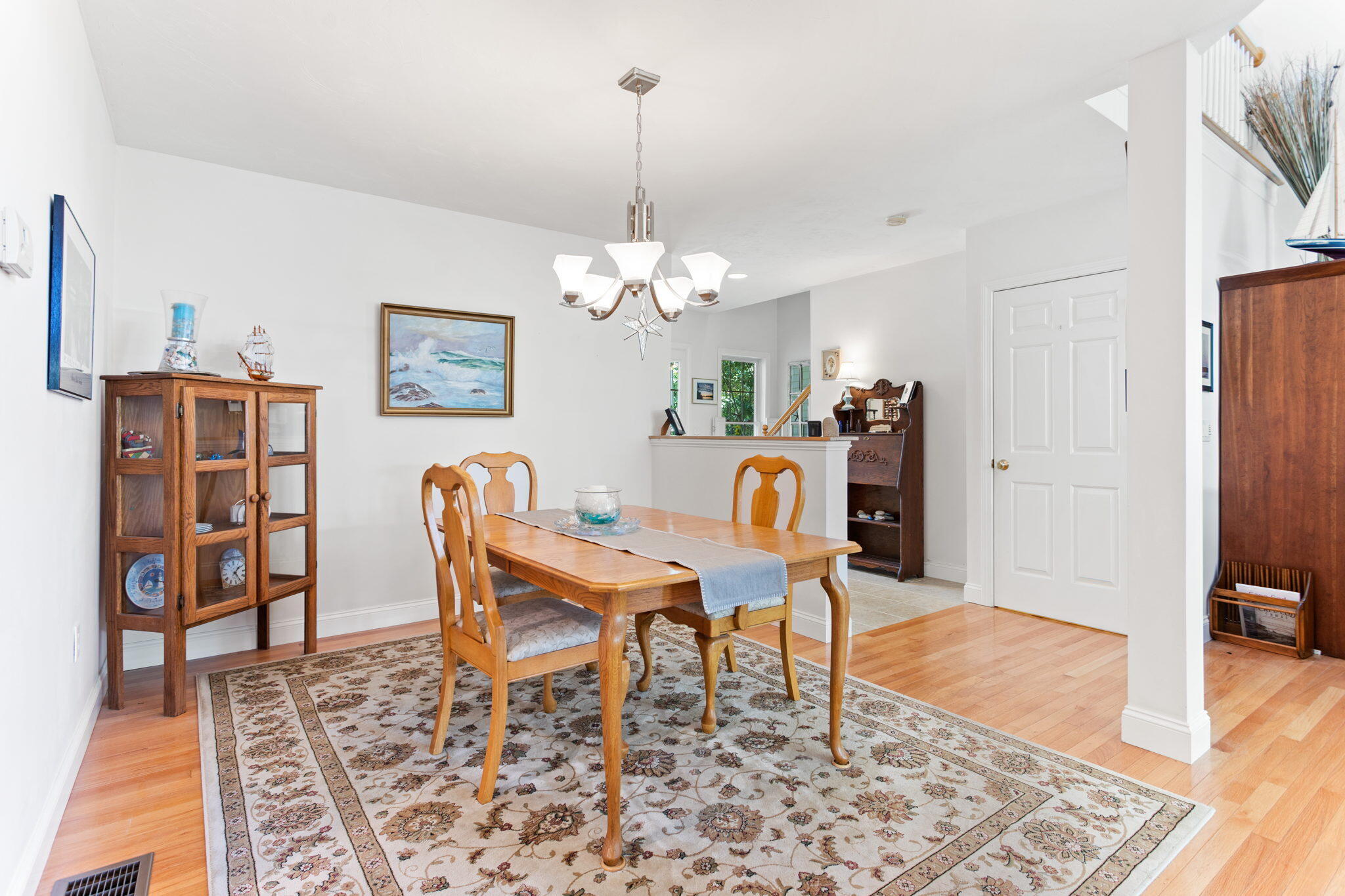 1 Prestwick Road Bourne, MA 02532 - Photo 9 of 32 a dining room with furniture and wooden floor