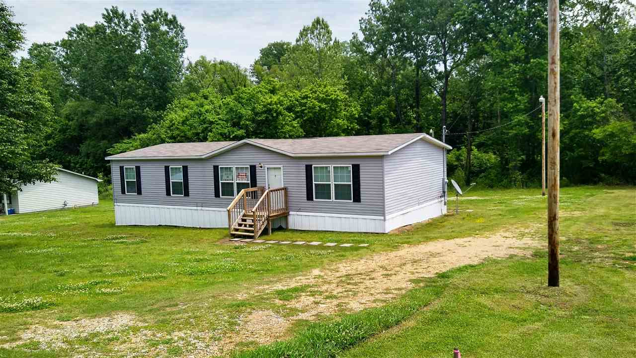 4224 Chicken George Trail Ripley, TN 38063 - Photo 1 of 8 a view of a house with a yard and deck