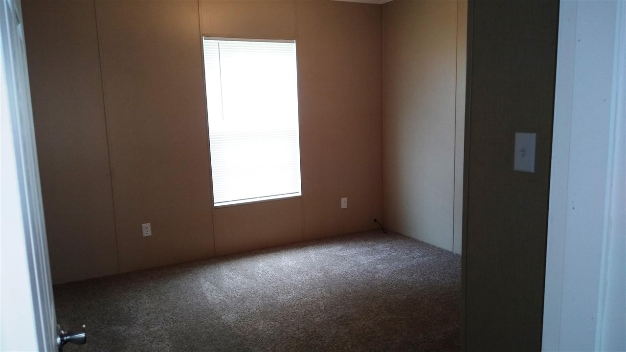 4224 Chicken George Trail Ripley, TN 38063 - Photo 7 of 8 a view of an empty room with a window