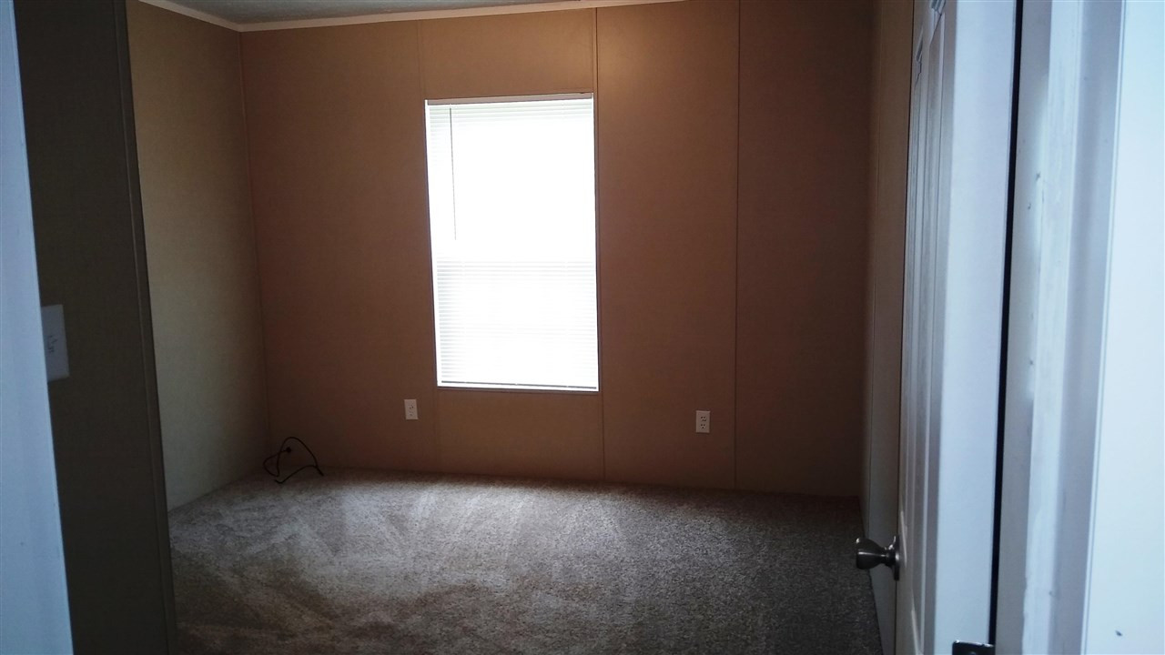 4224 Chicken George Trail Ripley, TN 38063 - Photo 8 of 8 an empty room with a window