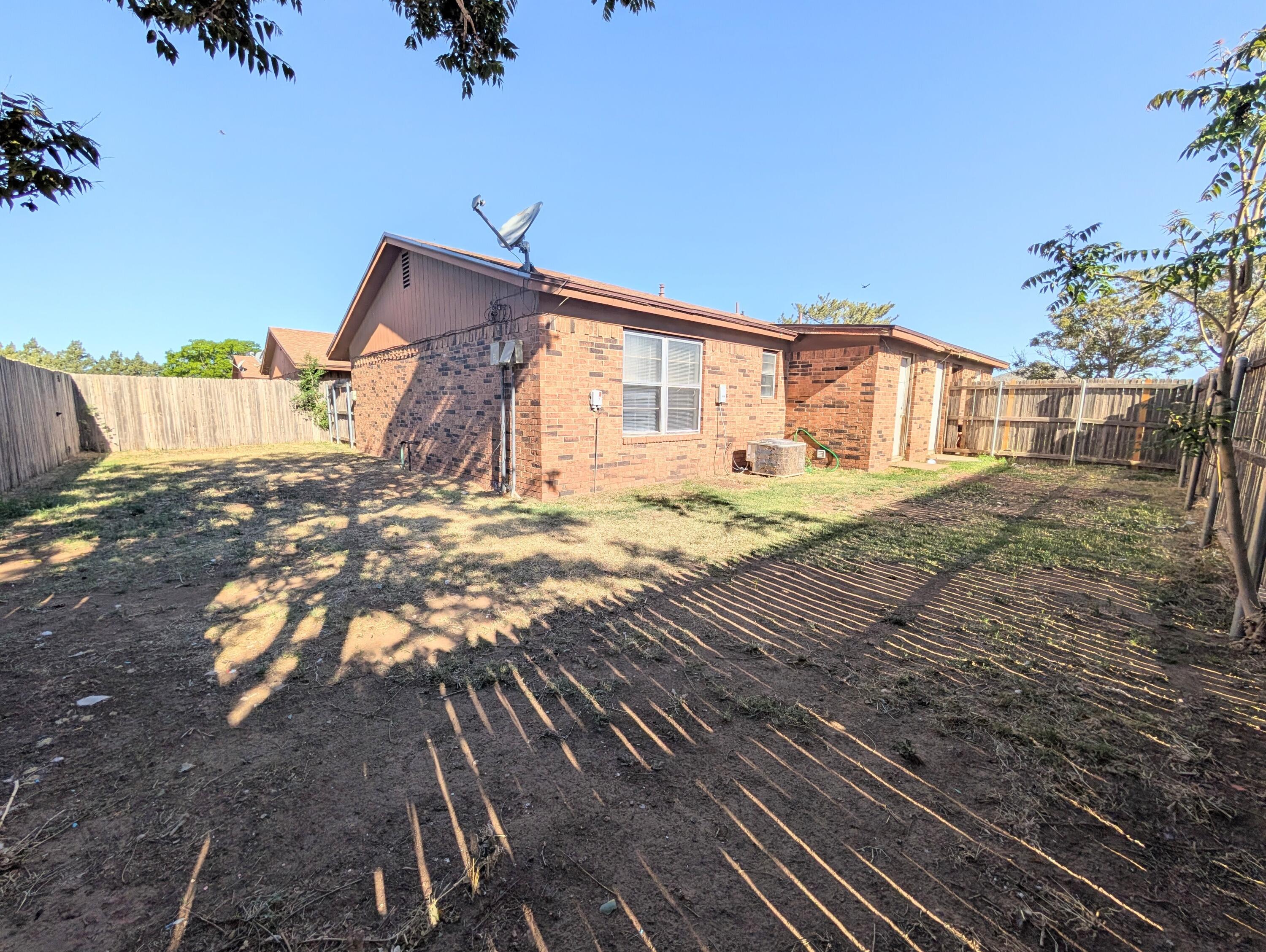 6509 21st Street, Unit B Lubbock, TX 79407 - Photo 9 of 9 a view of an house with backyard