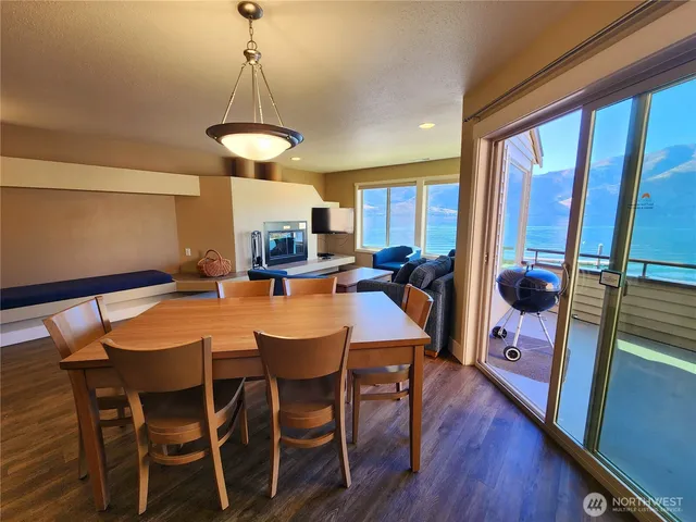 a view of washer and dryer with wooden floor
