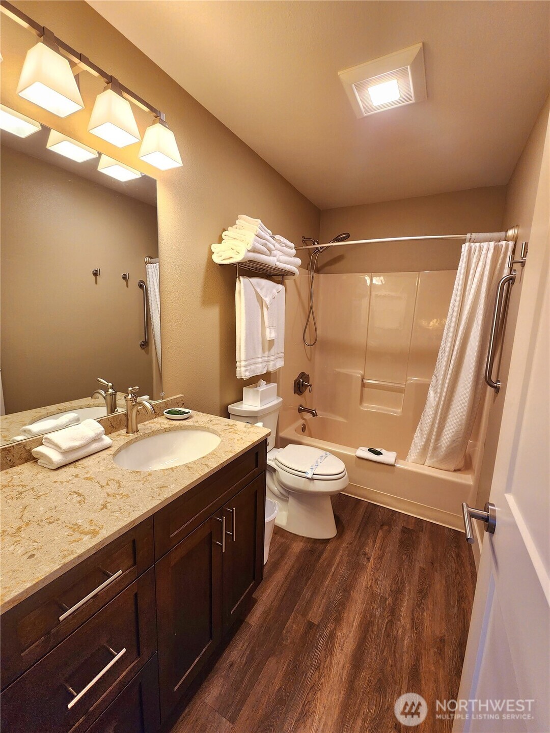 1 Lakeside 717-a Manson, WA 98831 - Photo 14 of 39 a bathroom with a granite countertop sink toilet and shower