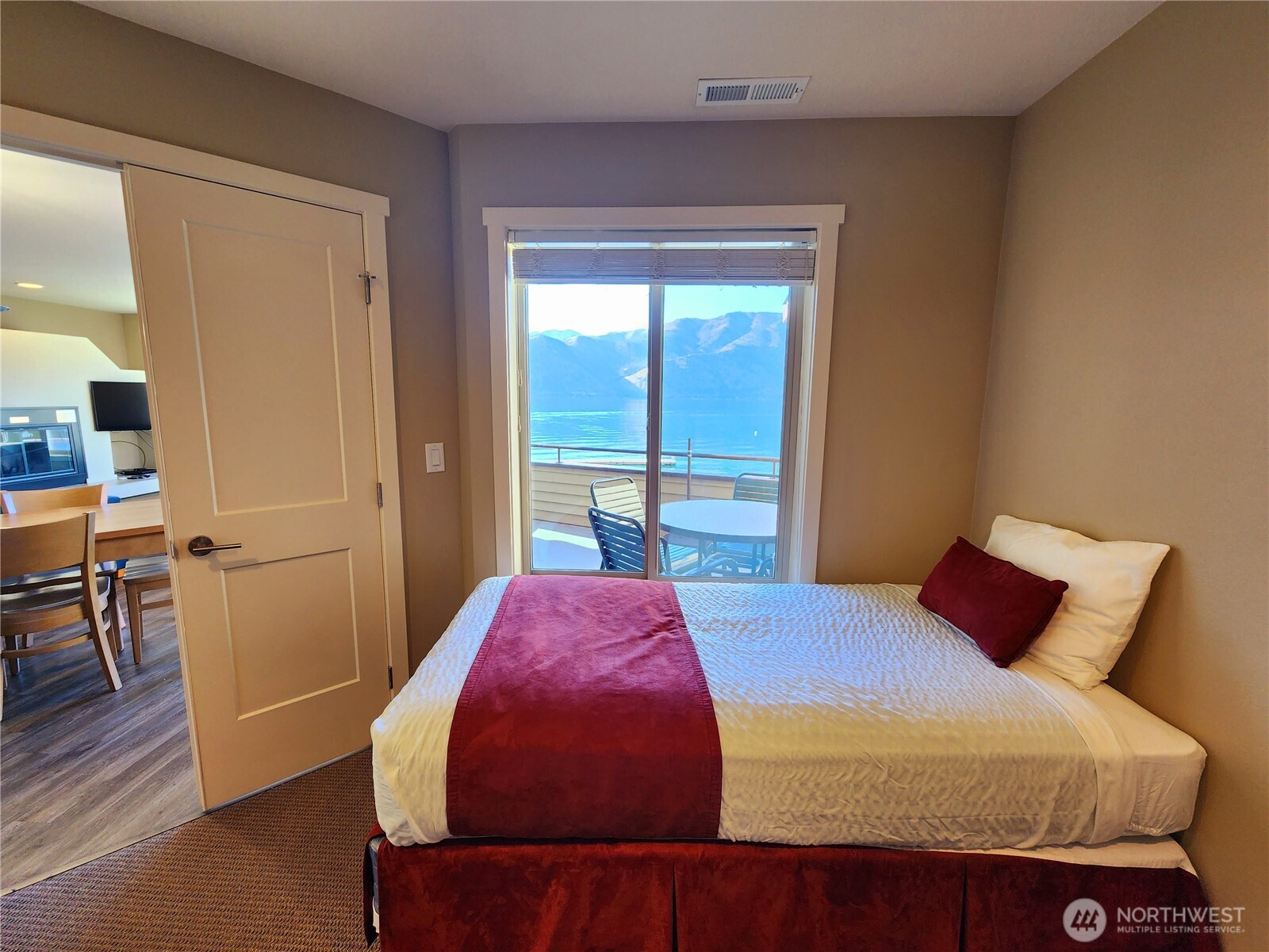 1 Lakeside 717-a Manson, WA 98831 - Photo 16 of 39 a bedroom with a bed and wooden floor