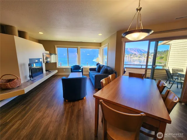 a view of a dining room with furniture window and wooden floor