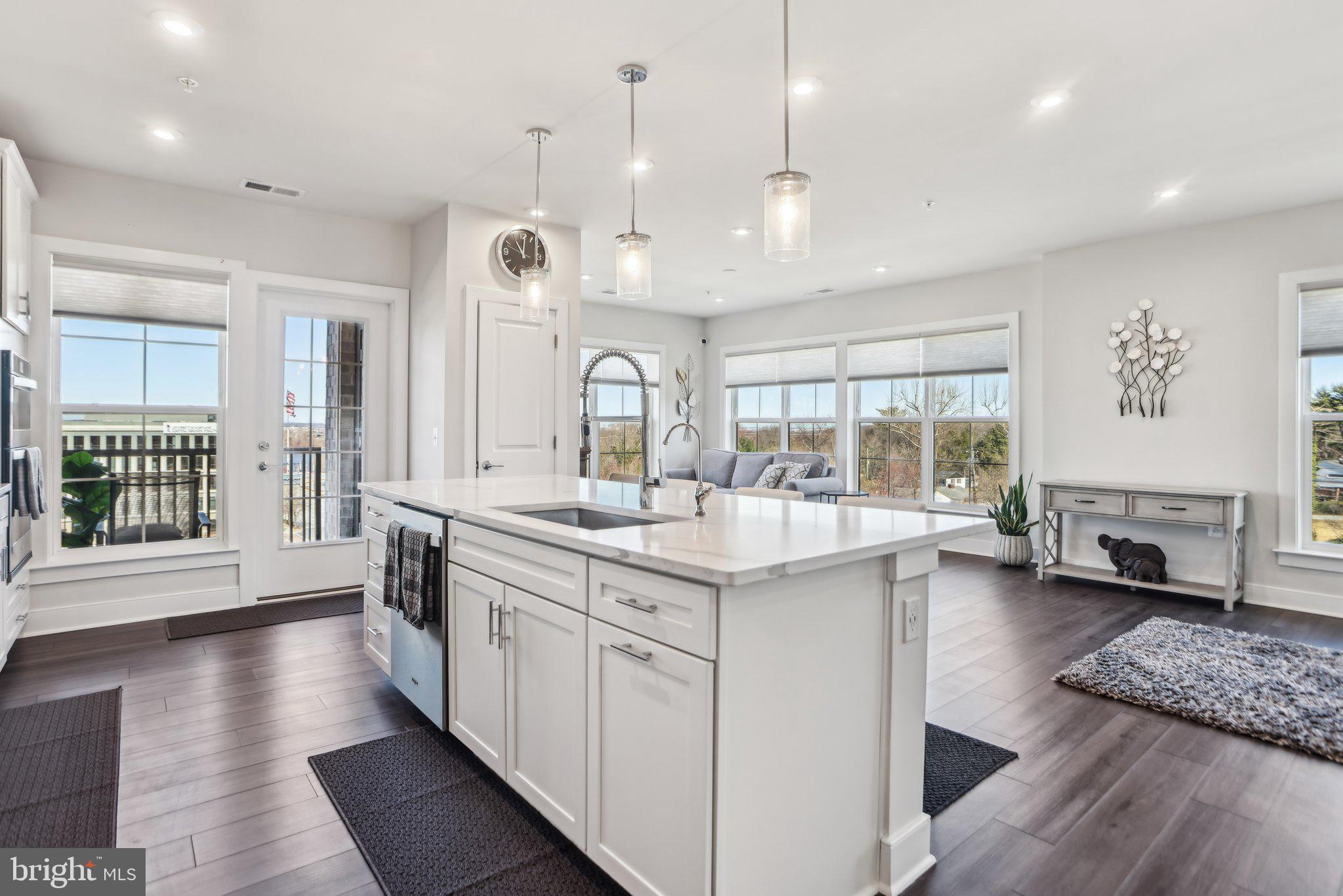 100 St Ives Place, Unit 306 Oxon Hill, MD 20745 - Photo 13 of 32 an open kitchen with a large sink