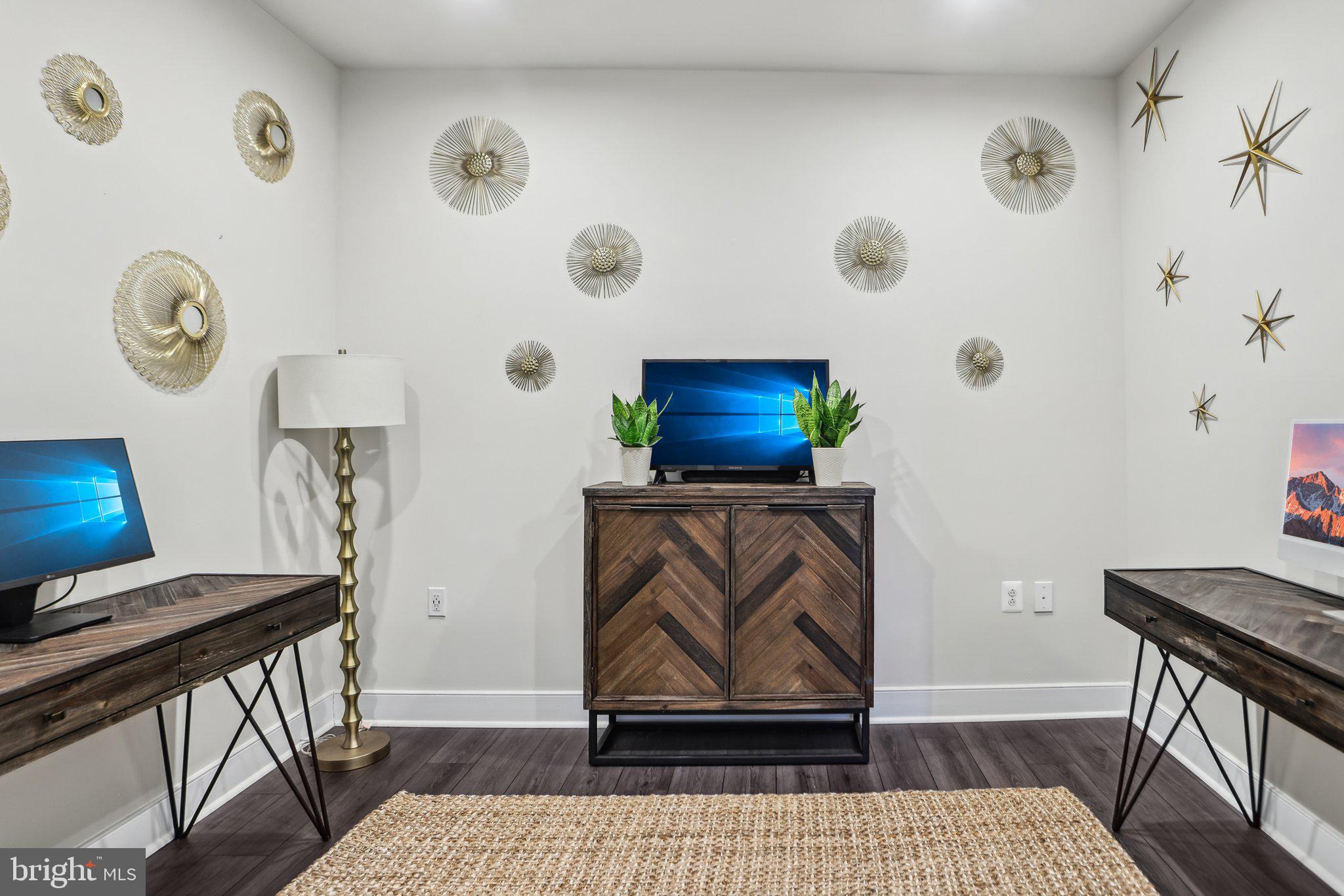 100 St Ives Place, Unit 306 Oxon Hill, MD 20745 - Photo 15 of 32 a living room with furniture and a rug