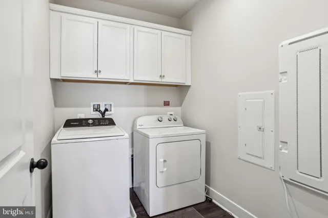 a view of storage and utility room with washer and dryer