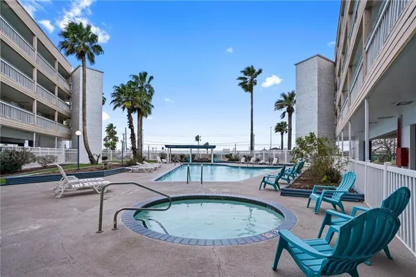 a view of a swimming pool with chairs