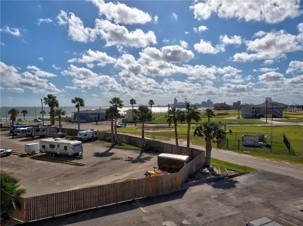 a view of a backyard with swimming pool