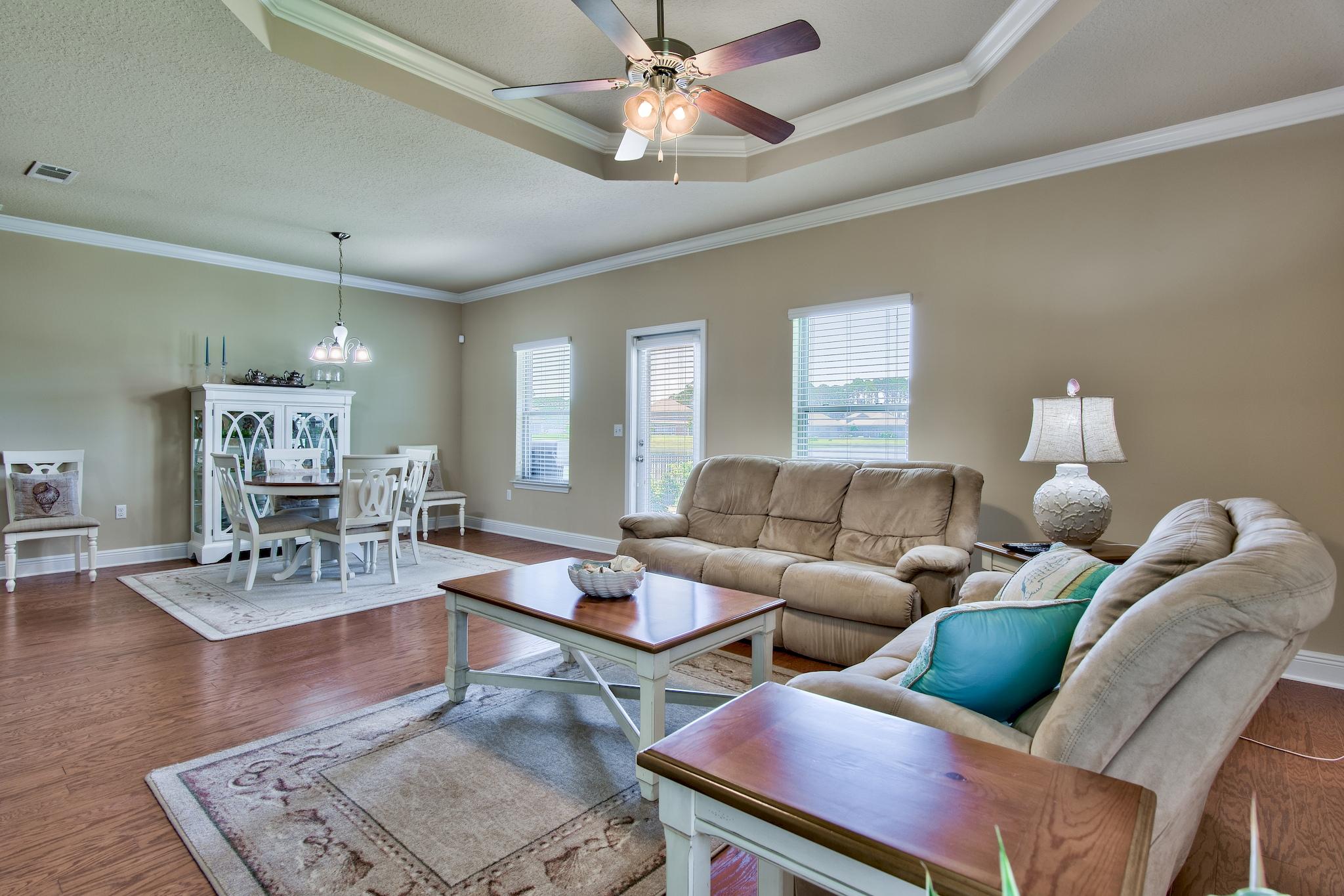 447 Pin Oak Loop Santa Rosa Beach, FL 32459 - Photo 8 of 46 a living room with furniture and wooden floor