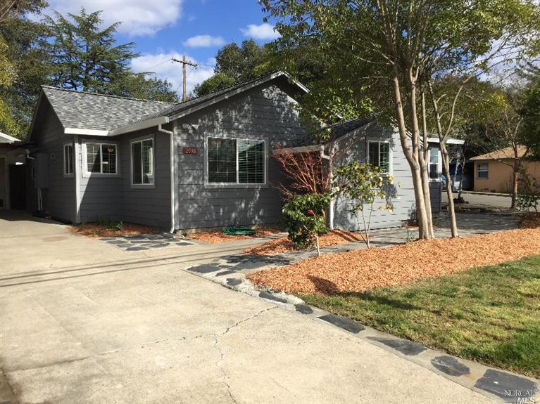 2038 Franklin Avenue Santa Rosa, CA 95404 - Photo 1 of 1 a front view of a house with a yard and garage