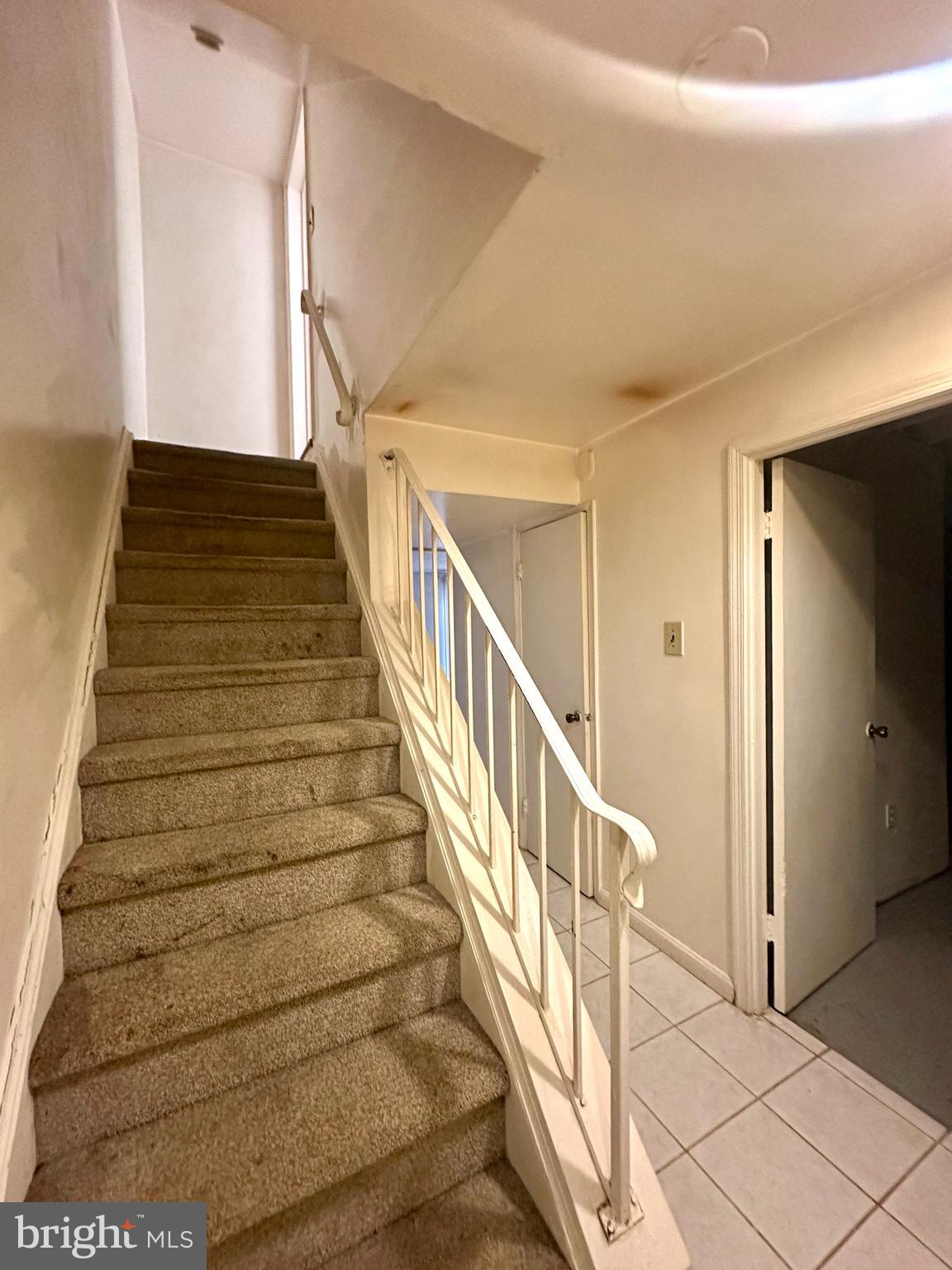 8357 Luce Court Springfield, VA 22153 - Photo 18 of 28 staircase from the 1st level up to the 2nd level