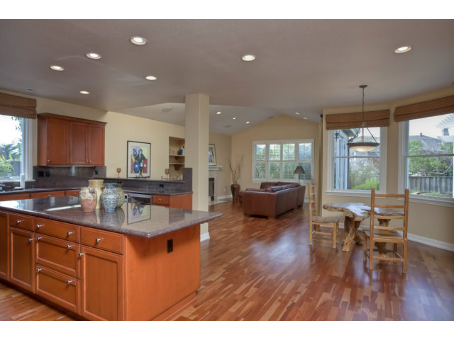 143 Cypress Point Road Half Moon Bay, CA 94019 - Photo 12 of 21 a living room with furniture a wooden floor and a large window