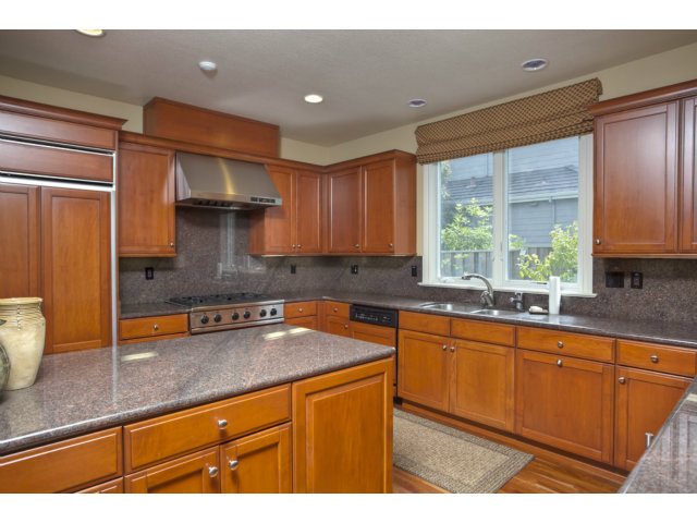 143 Cypress Point Road Half Moon Bay, CA 94019 - Photo 10 of 21 a kitchen with stainless steel appliances a sink stove and window