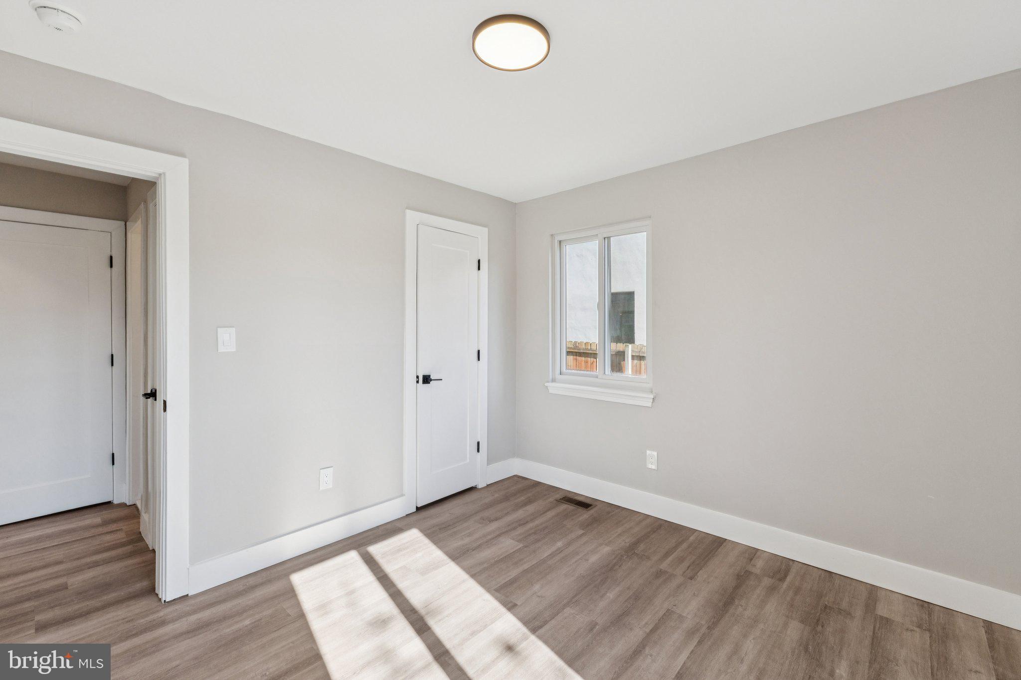 10101 Greeley Avenue Silver Spring, MD 20902 - Photo 12 of 25 a view of empty room with wooden floor