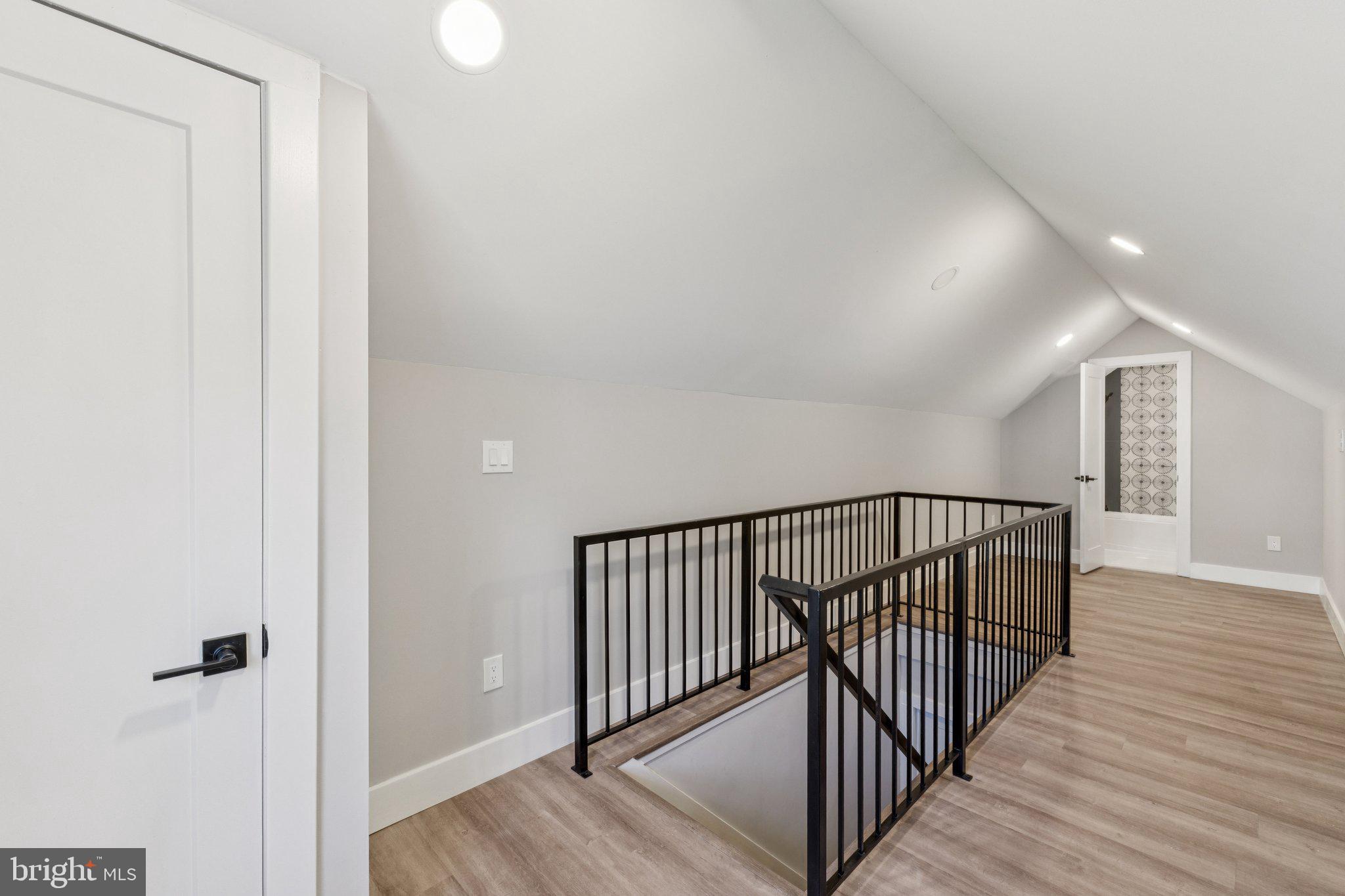10101 Greeley Avenue Silver Spring, MD 20902 - Photo 14 of 25 a view of a hallway with wooden floor and staircase