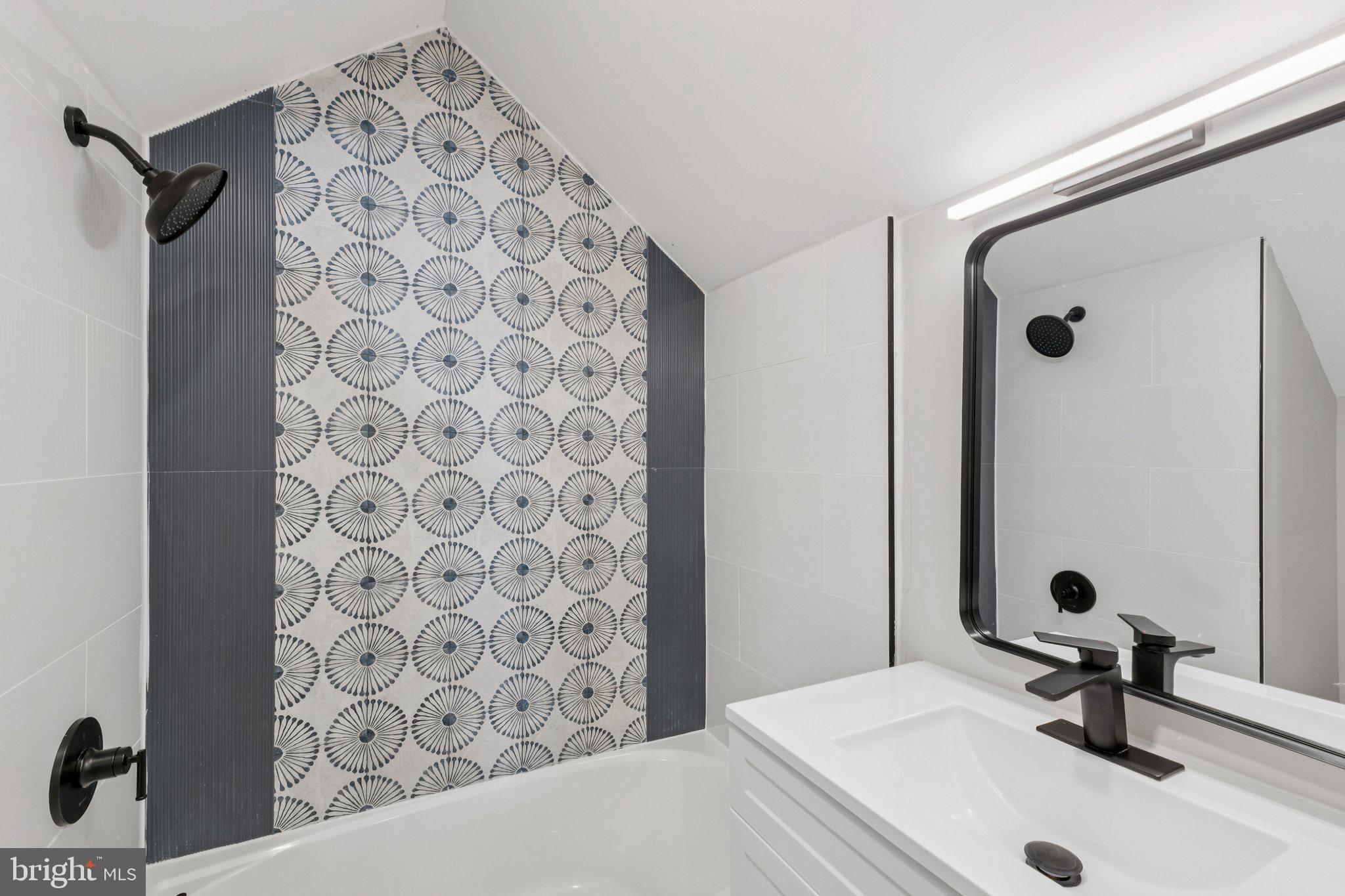 10101 Greeley Avenue Silver Spring, MD 20902 - Photo 16 of 25 a bathroom with a sink and a mirror