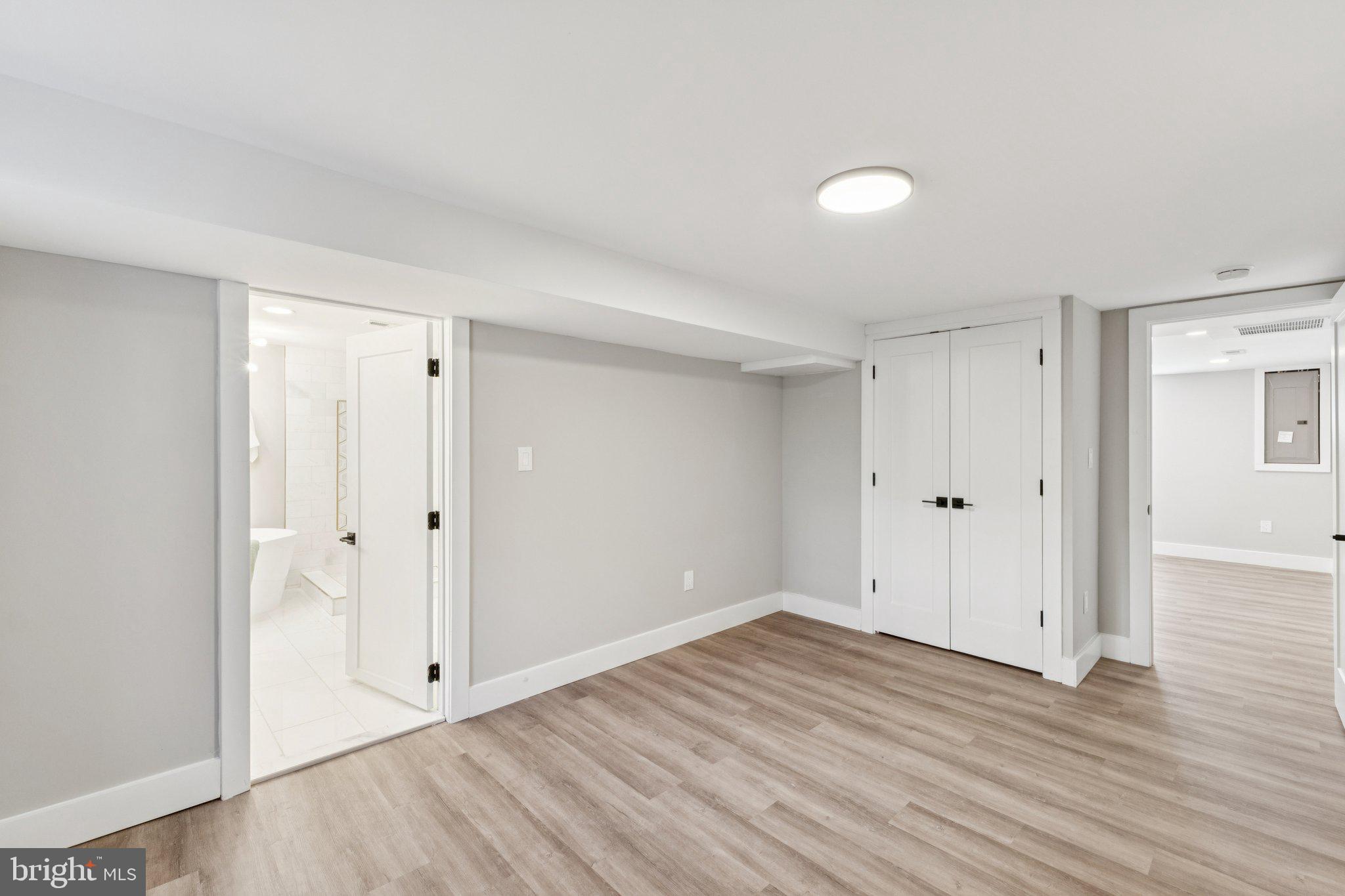 10101 Greeley Avenue Silver Spring, MD 20902 - Photo 20 of 25 a view of an empty room with wooden floor