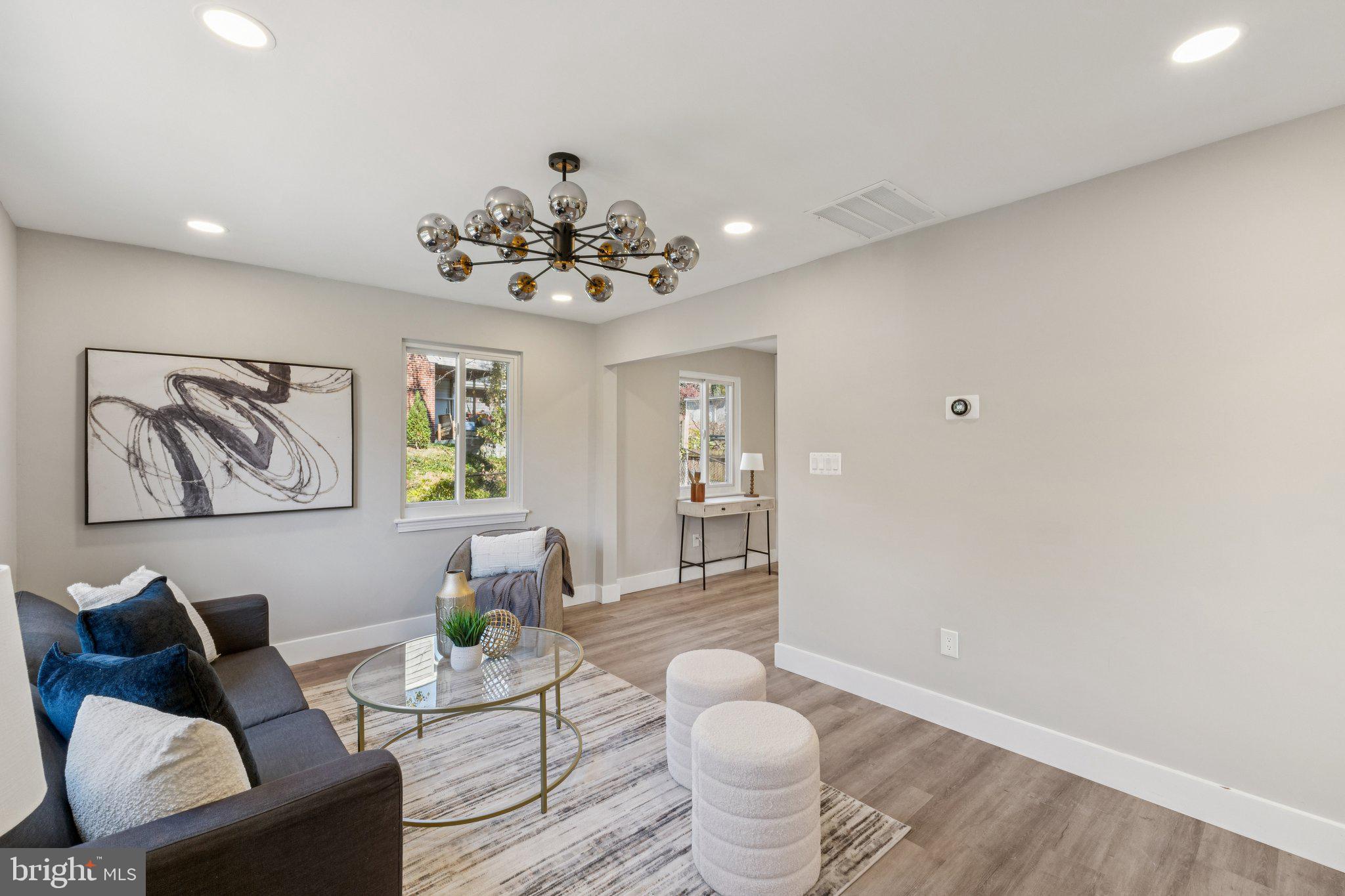 10101 Greeley Avenue Silver Spring, MD 20902 - Photo 2 of 25 a living room with furniture and a table