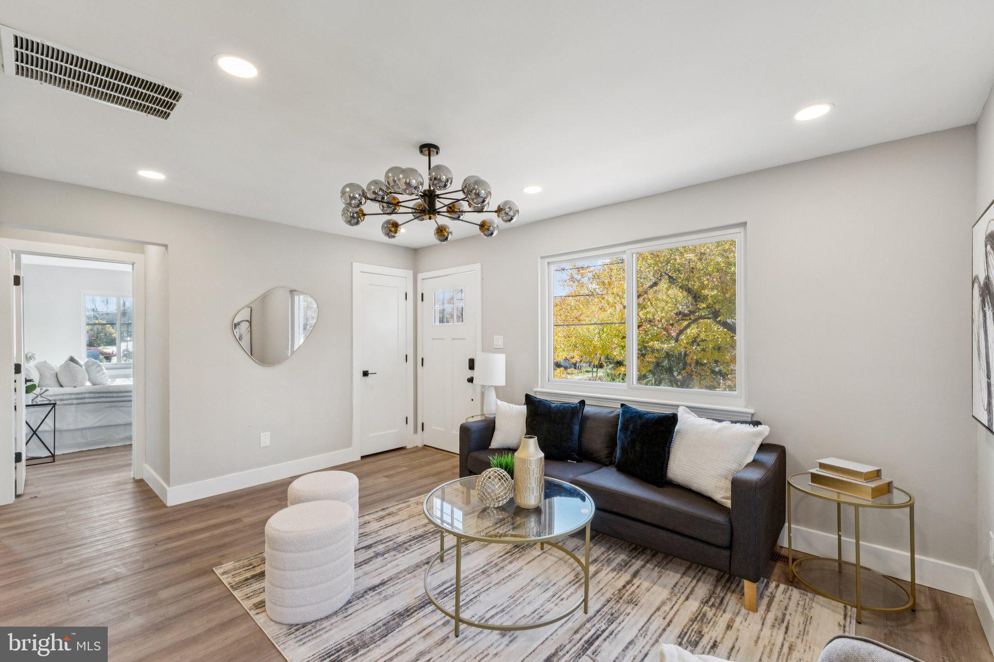 10101 Greeley Avenue Silver Spring, MD 20902 - Photo 3 of 25 a living room with furniture and a large window