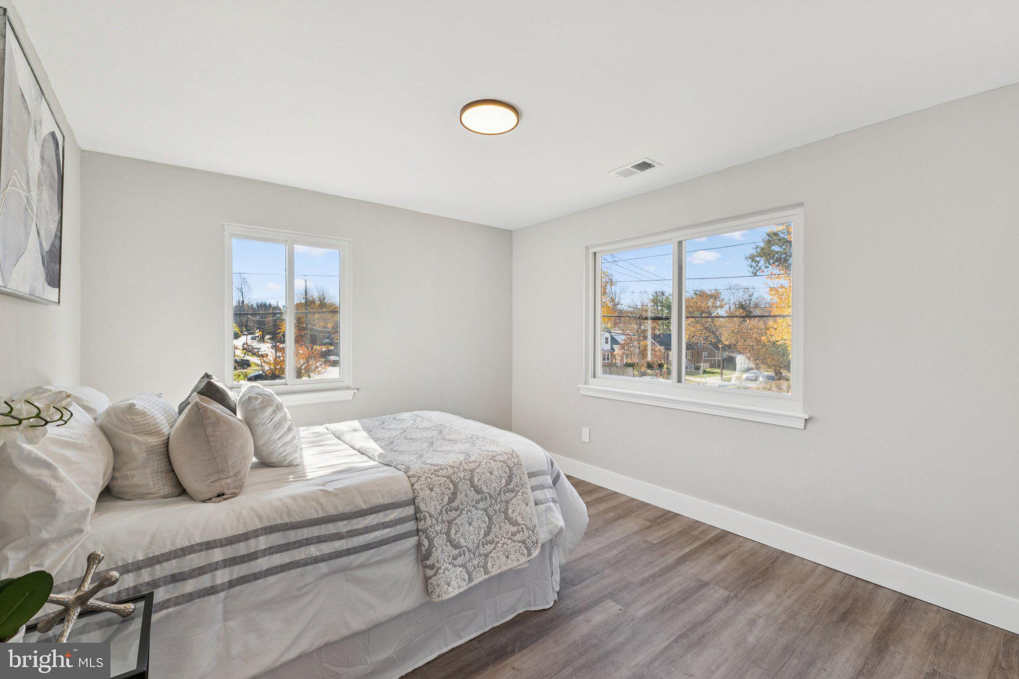 10101 Greeley Avenue Silver Spring, MD 20902 - Photo 6 of 25 a bedroom with a bed and a window